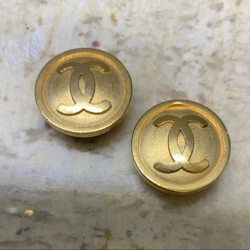 2 Chanel gold colored button covers